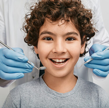 boy happy to take treatment in Valley Dental & Orthodontics - Clovis